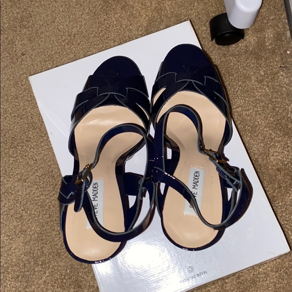 A navy blue Steve Madden high heel shoe.